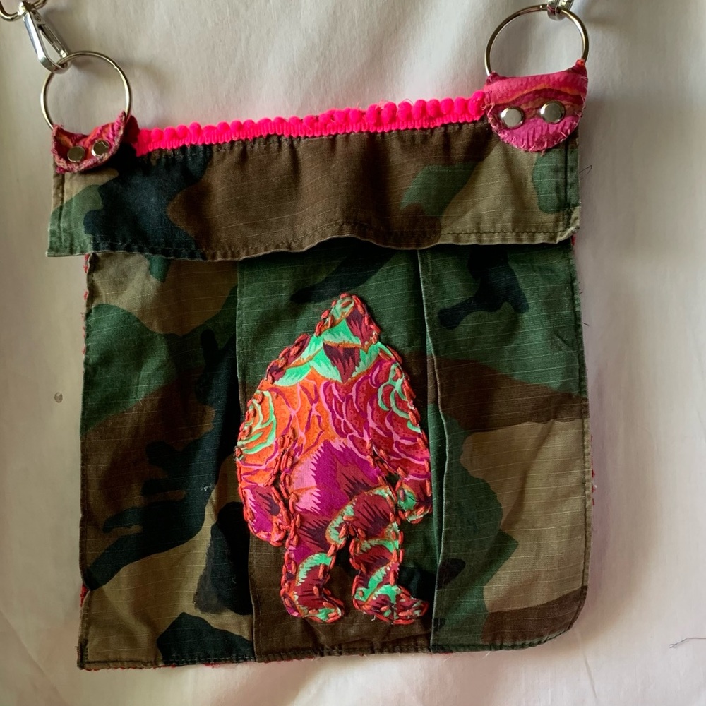 Upcycled Camouflage Crossbody Bag with Bright Pink Bigfoot Sillouette.